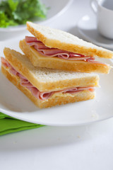 two sandwich with ham and cheese butter