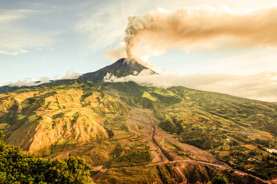 A dramatic eruption of the active Tungurahua volcano in Ecuador sends a massive cinder cloud into the sky, captivating locals with its volcanic power.