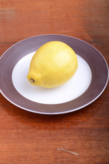 fresh lemon on grey plate