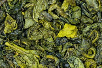 Analyze the detailed portrayal of Green Tea infused with mint showcased in a high quality studio shot elucidating its aromatic complexity and potential health properties