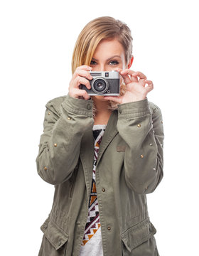 pretty young woman taking photos on a white background