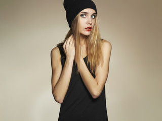 fashionable beautiful young woman in hat.beauty blond girl in cap
