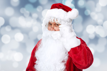 Santa Claus over sparkle abstract background.