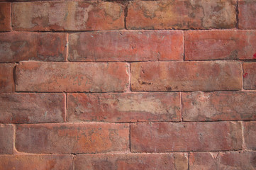Fototapeta premium Old brick wall with rough and scuffed