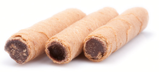 Indulge in the rich and decadent beauty of chocolate sticks with a closeup shot on a pristine white reflective background.