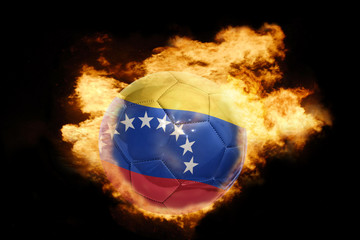 football ball with the flag of venezuela on fire
