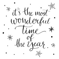 It's the most wonderful time of the year. Inspirational quote about winter. Modern calligraphy phrase with hand drawn snowflakes. Lettering for christmas
