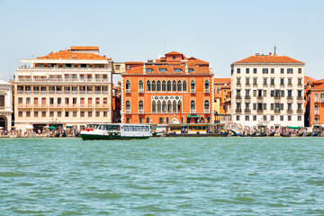 Experience the breathtaking view of historic buildings in Venice from the enchanting San Maggiore Island,a true feast for the eyes.