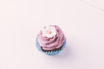 Cupcake on white wooden table