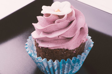 Cupcake on black dish
