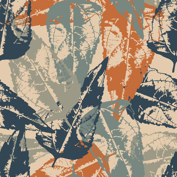 Grunge pattern with leaves on light brown background