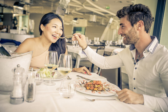 Young couple eating in a restaurant.