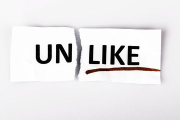 The word unlike changed to like on torn paper