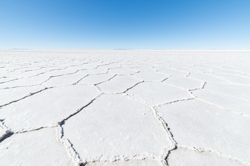 Fototapeta na wymiar Hexagonal shapes on the Uyuni Salt Flat, Bolivia