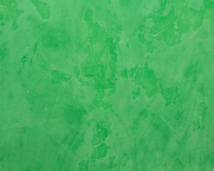 Background of green Venetian plaster.