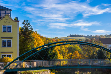 bridge and house in the little village Freital Dresden in autumn