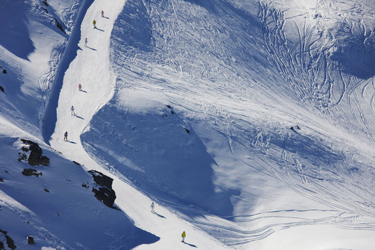 Aerial view of skiers on a prepared piste in the three valleys, France