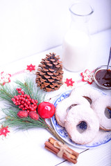 Donuts for Christmas breakfast on white wooden table