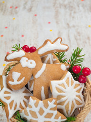 Reindeer and stars cookies, Christmas tree and red berries