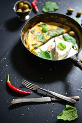 Fresh white cheese with scrambled eggs and spinach