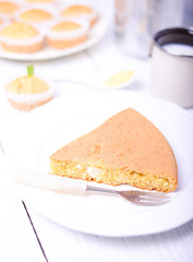 Peace of cornbread on white wooden table