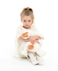 Fototapeta na wymiar Little Girl in a White Dress Posing