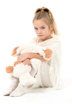 Little Girl in a White Dress Posing