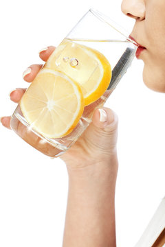 Woman Drinking Water With Lemon