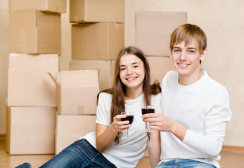 Young couple celebrating moving to new home