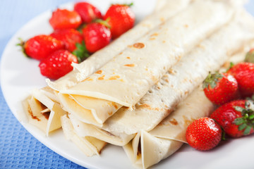 Pancakes with chocolate and strawberries