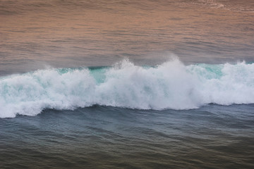 Blue wave at sunset Bali Beach ,Indonesia.