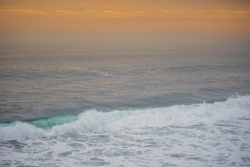 Blue wave at sunset Bali Beach ,Indonesia.