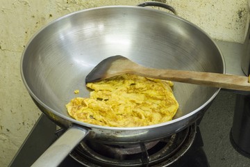 The fried egg Cooking in a pan at a kitchen
 Smell good and easy to do - thailand food