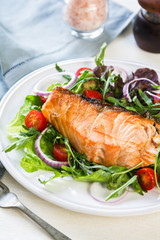 Salmon steak with salad