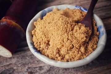 Brown sugar with sugar cane