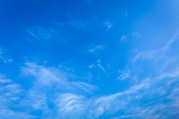 wind blows clouds in blue sky background