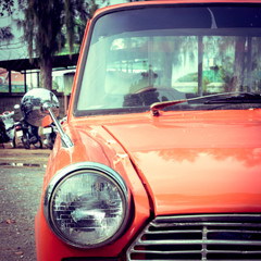 close-up headlight of colourful classic car