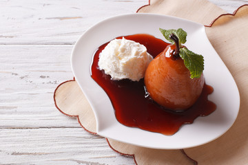 Vanilla ice cream and caramelized pear close-up. horizontal
