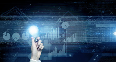 Glowing bulb in hand. Concept image