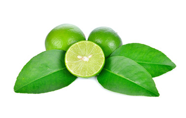 Limes with slices and leaves isolated on white background