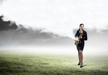 Woman saxophonist. Concept image