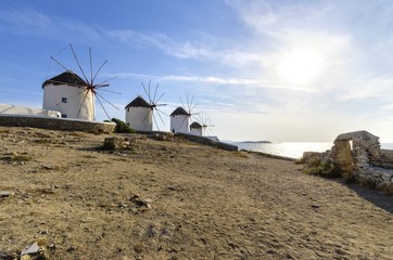 Five windmills in Chora,Mykonos,Greece.Traditional greek whitewashed architecture,a popular landmark,tourist destination on the island of winds,deep blue sky,Aegean sea. Wind mills are now decorative. © f8grapher