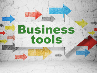 Business concept: arrow with Business Tools on grunge wall background