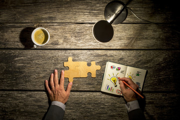 Top view of businessman working and brainstorming  at his wooden