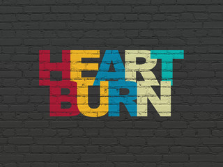 Health concept: Heartburn on wall background