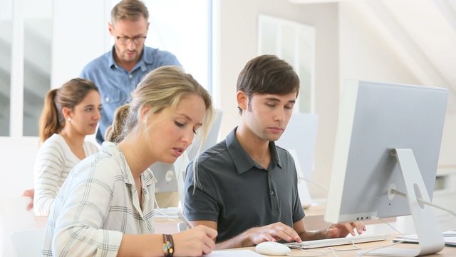 Students working together on desktop