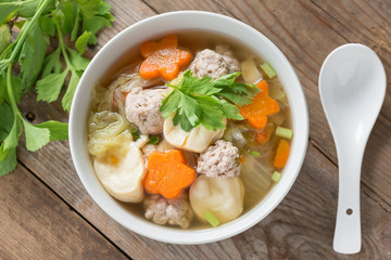 Clear Soup with Vegetables and Meatballs. Top view.