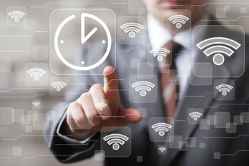 Businessman hand press button time clock wifi web network