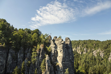 Sandstone rocks, forests and blue sky in the Germany Switzerland