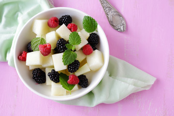 summer salad with melon and blackberries